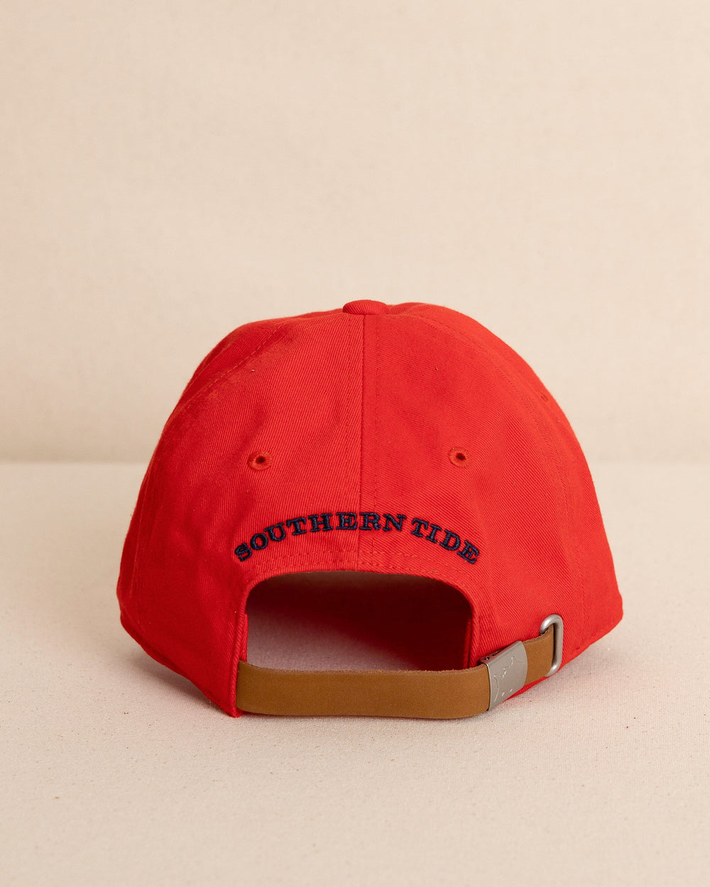 The back view of the Southern Tide Kids Uh Oh Sharks Leather Strap Hat by Southern Tide - Poppy Red