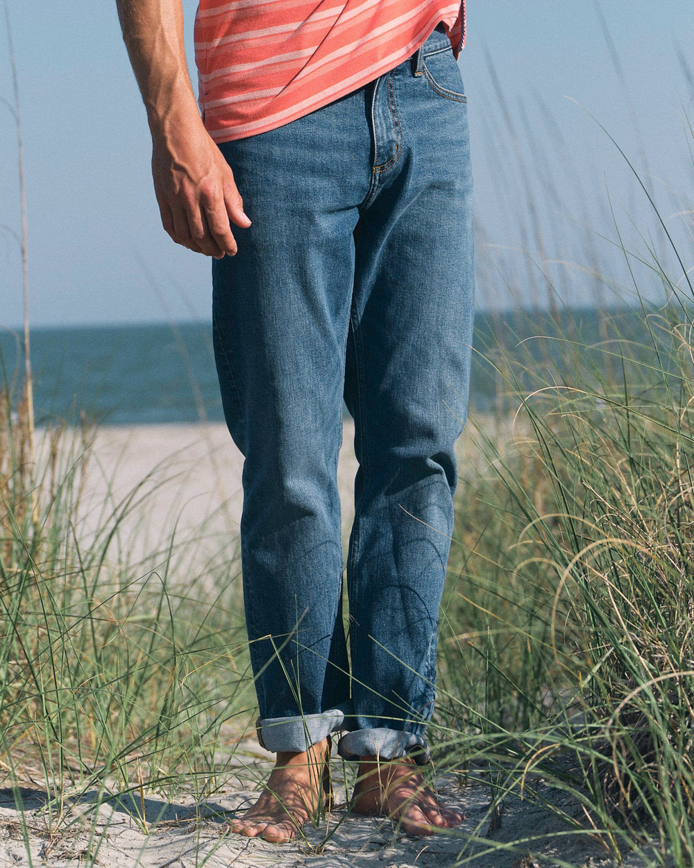 The lifestyle view of the Southern Tide King Street Denim Pant by Southern Tide - Medium Wash