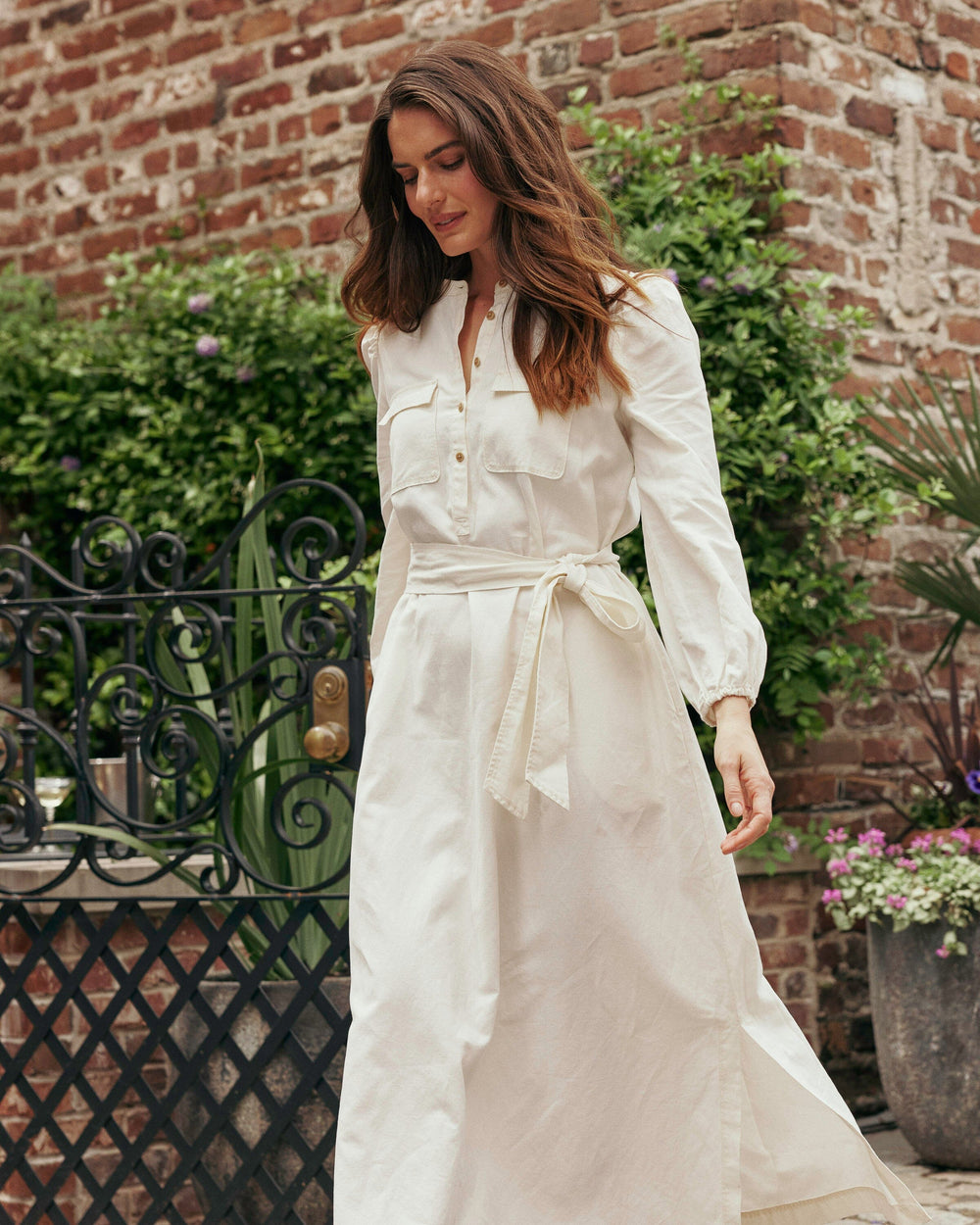 The lifestyle view of the Southern Tide Klara Maxi Dress by Southern Tide - Sand White