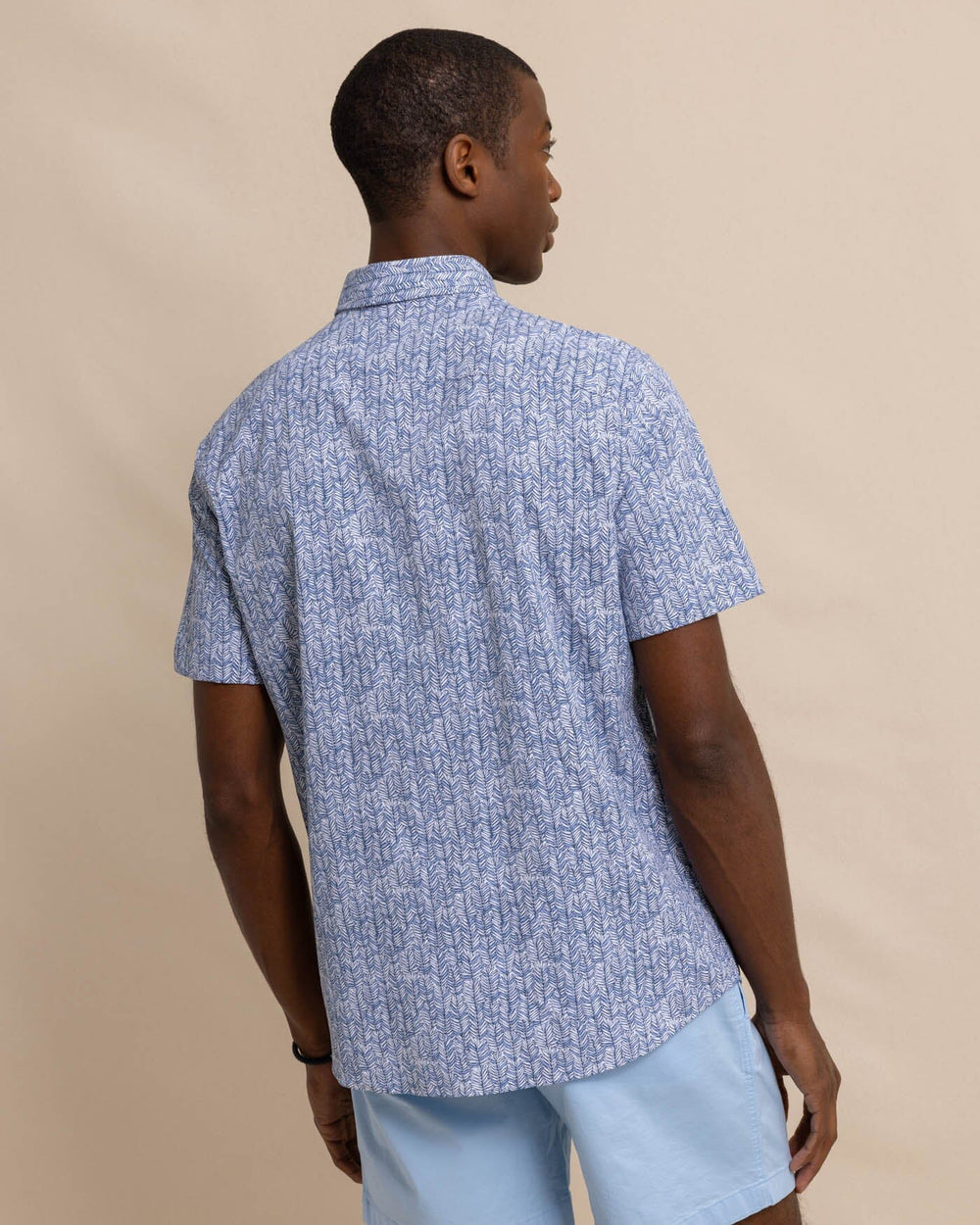 The back view of the Southern Tide Leagally Frond Intercoastal Short Sleeve Sport Shirt by Southern Tide - Eternal Blue
