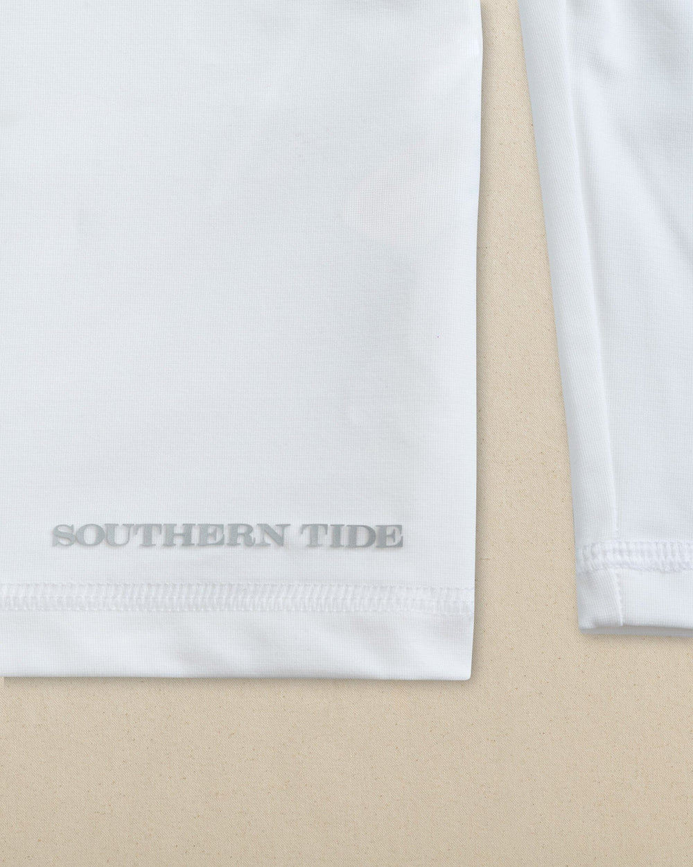 The detail view of the Southern Tide Lighthouse Coastal Breeze® Performance Hoodie by Southern Tide - Classic White