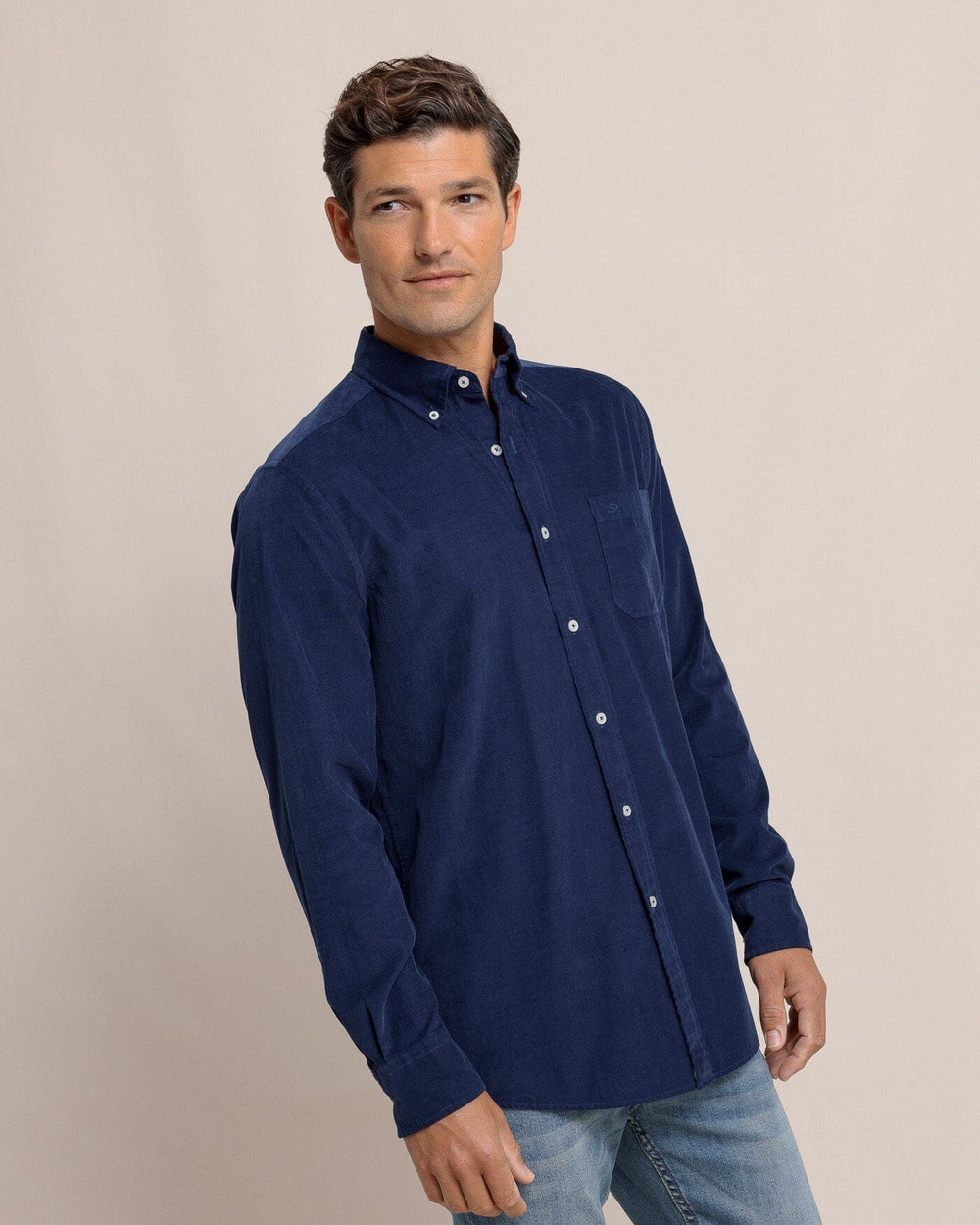 The side view of the Southern Tide Lightweight Bedford Cord Long Sleeve Sport Shirt by Southern Tide - Dress Blue