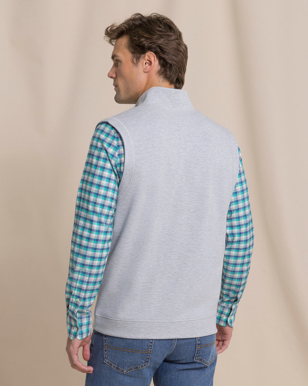 The back view of the Southern Tide Lightweight Knit Heather Reversible Vest by Southern Tide - Heather Anchor Grey