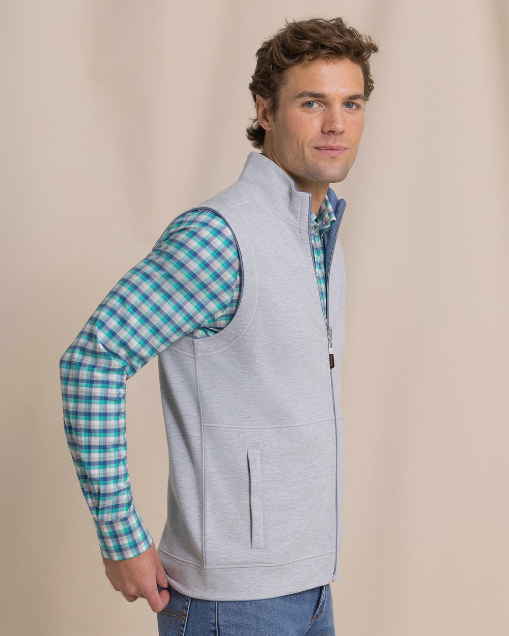 The side view of the Southern Tide Lightweight Knit Heather Reversible Vest by Southern Tide - Heather Anchor Grey