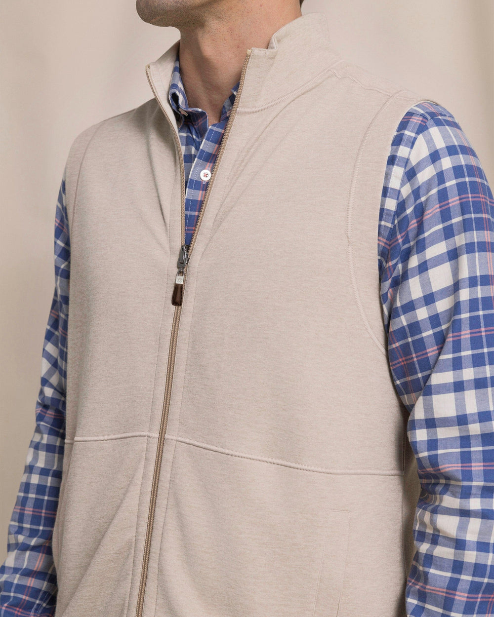 The detail view of the Southern Tide Lightweight Knit Heather Reversible Vest by Southern Tide - Heather Sandstone Khaki