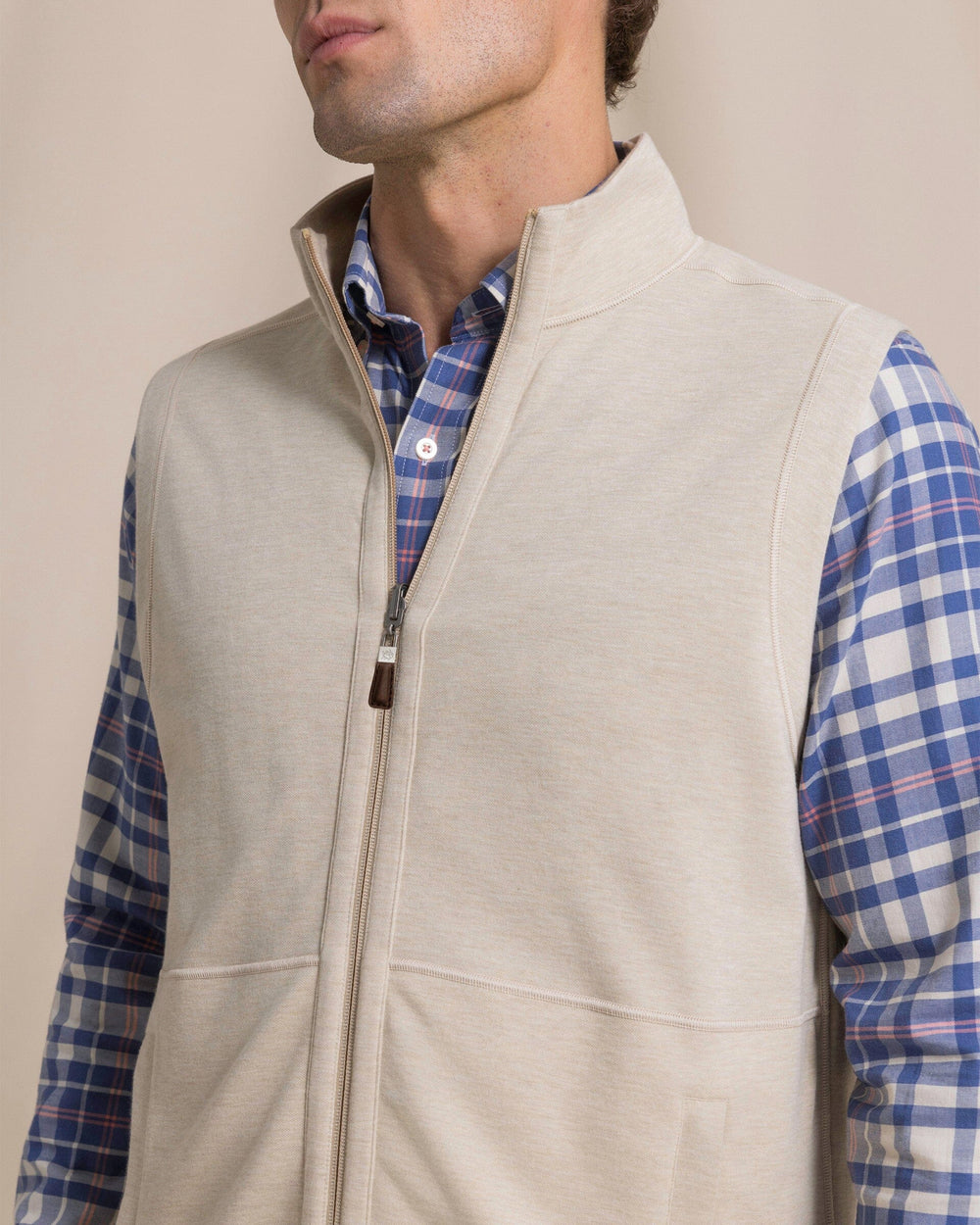 The detail view of the Southern Tide Lightweight Knit Heather Reversible Vest by Southern Tide - Heather Sandstone Khaki