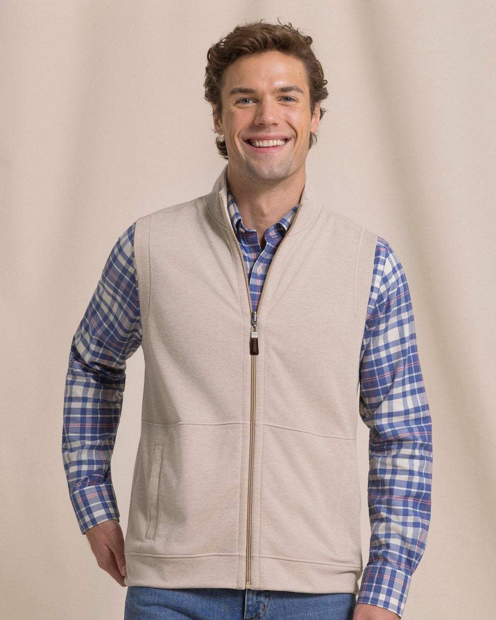 The front view of the Southern Tide Lightweight Knit Heather Reversible Vest by Southern Tide - Heather Sandstone Khaki