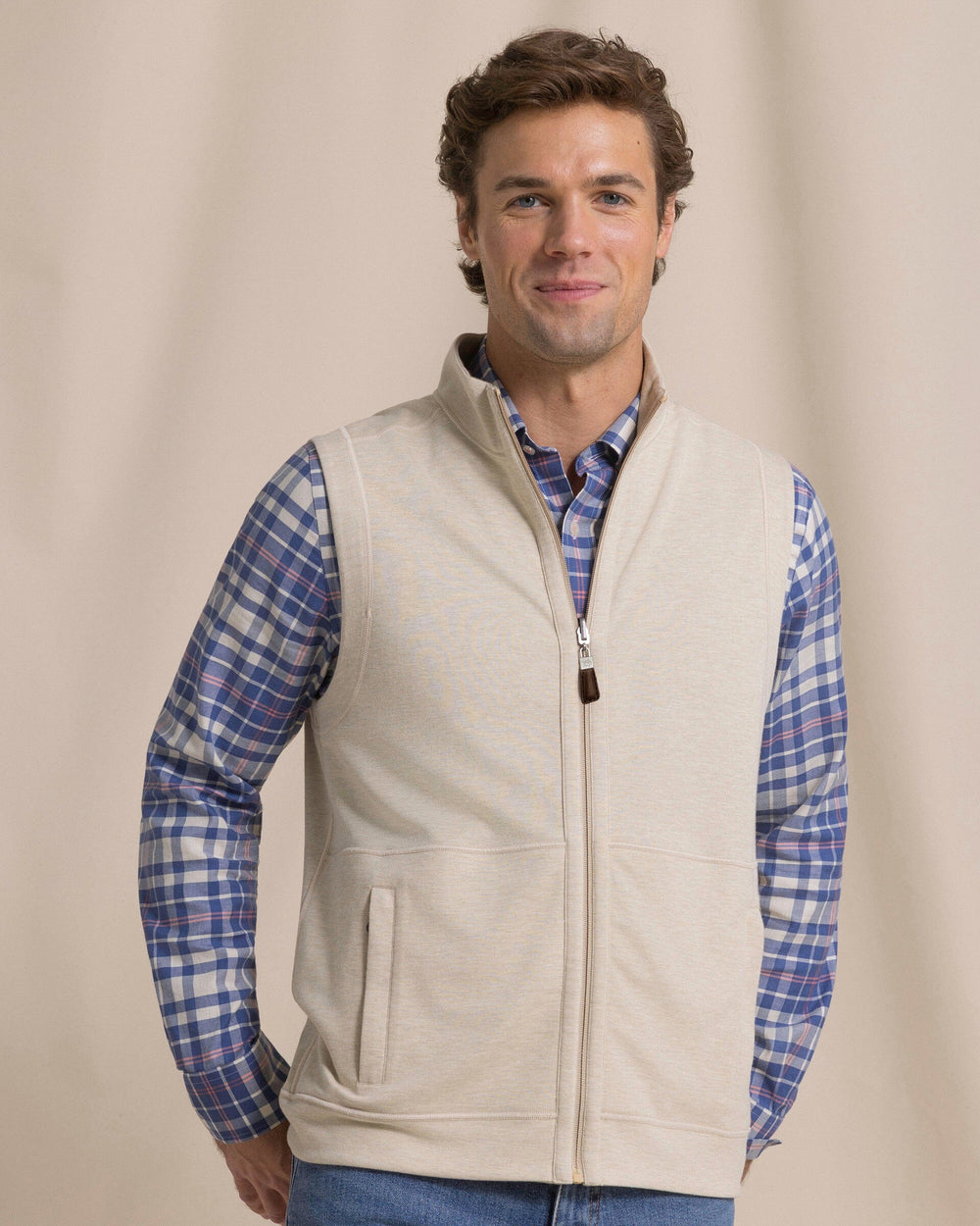 The front view of the Southern Tide Lightweight Knit Heather Reversible Vest by Southern Tide - Heather Sandstone Khaki