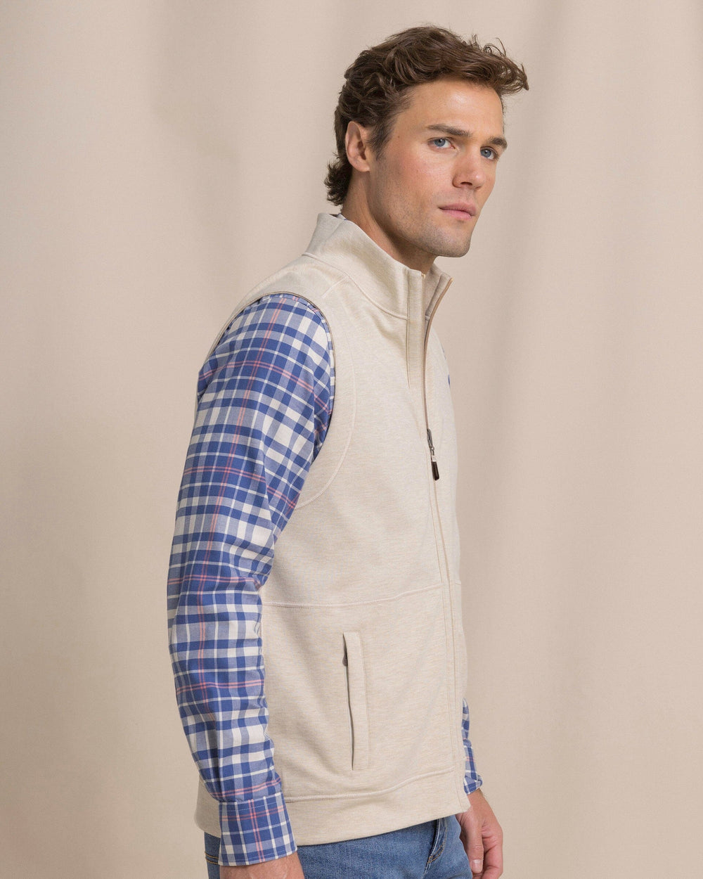 The side view of the Southern Tide Lightweight Knit Heather Reversible Vest by Southern Tide - Heather Sandstone Khaki