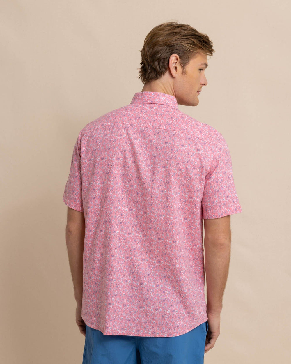 The back view of the Southern Tide Linen Rayon Ditzy Floral Short Sleeve Sport Shirt by Southern Tide - Geranium Pink