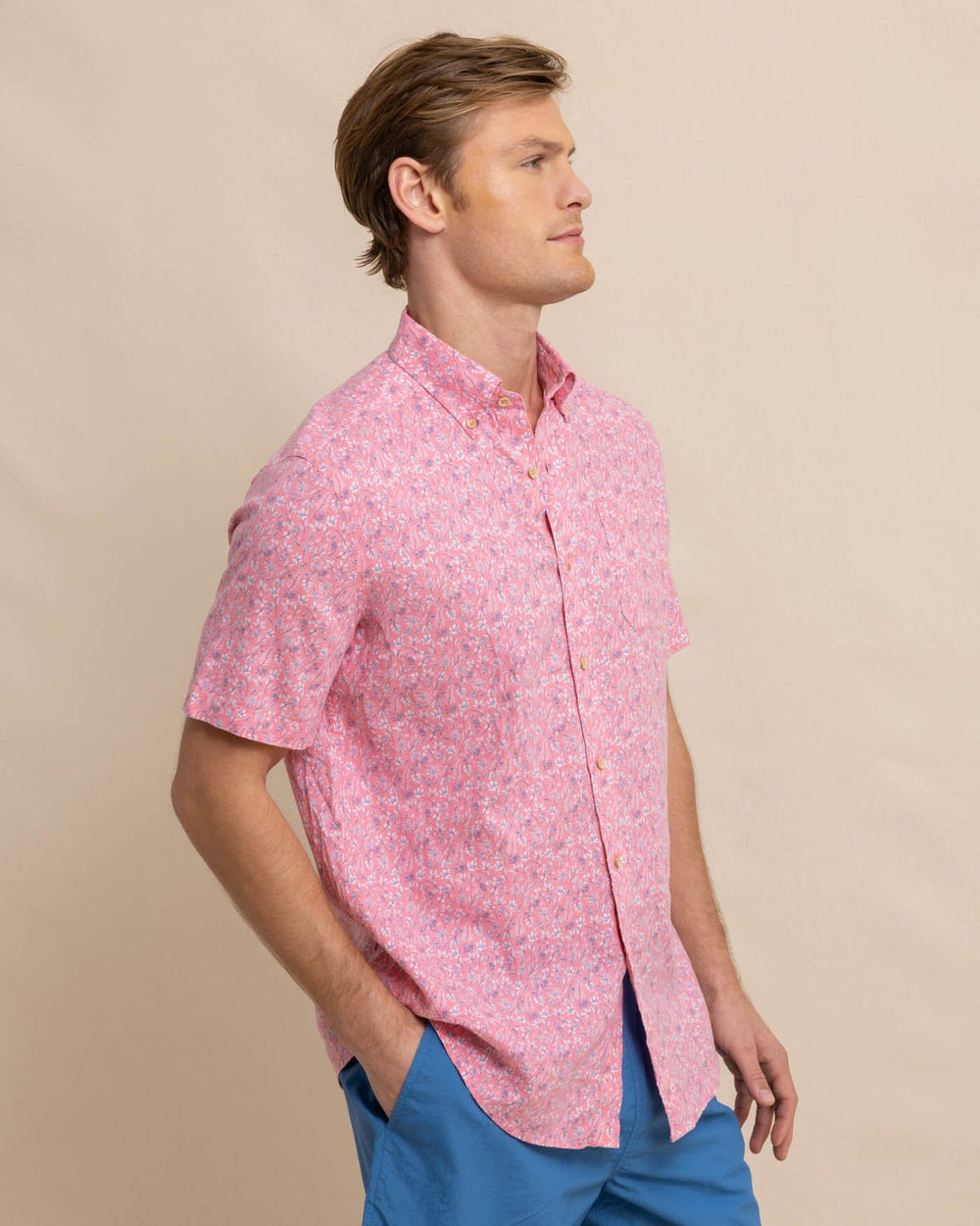 The front view of the Southern Tide Linen Rayon Ditzy Floral Short Sleeve Sport Shirt by Southern Tide - Geranium Pink