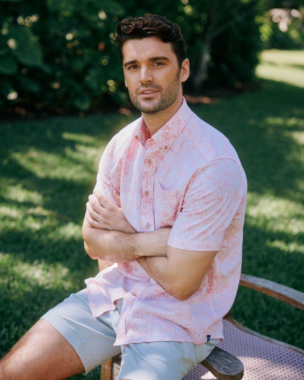 The lifestyle view of the Southern Tide Linen Rayon Keep Palm and Carry On Print Sport Shirt by Southern Tide - Rosewood Red