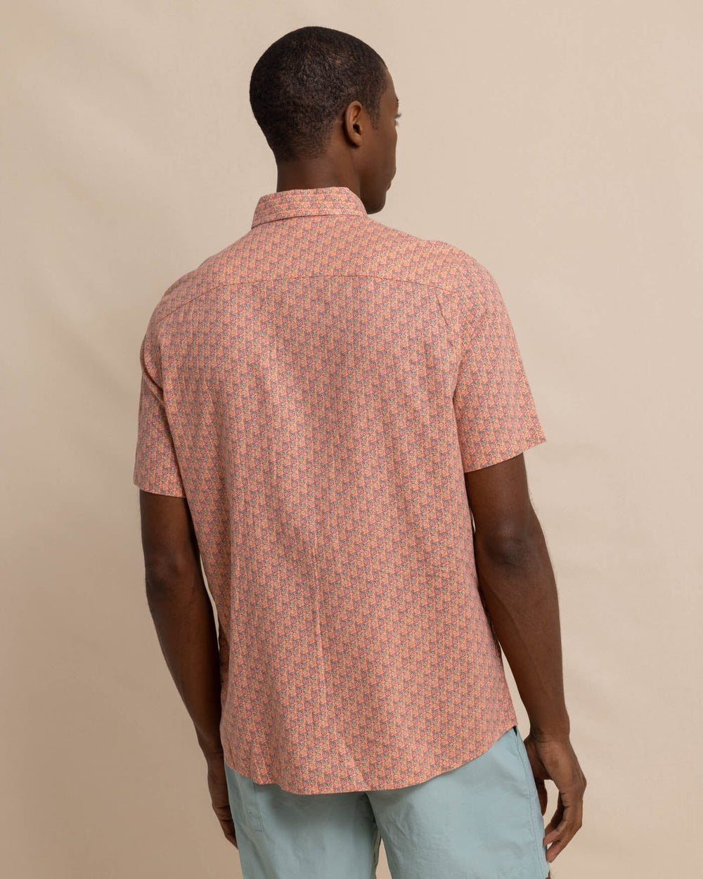 The back view of the Southern Tide Linen Rayon Vacation Views Short Sleeve SportShirt by Southern Tide - Desert Flower Coral