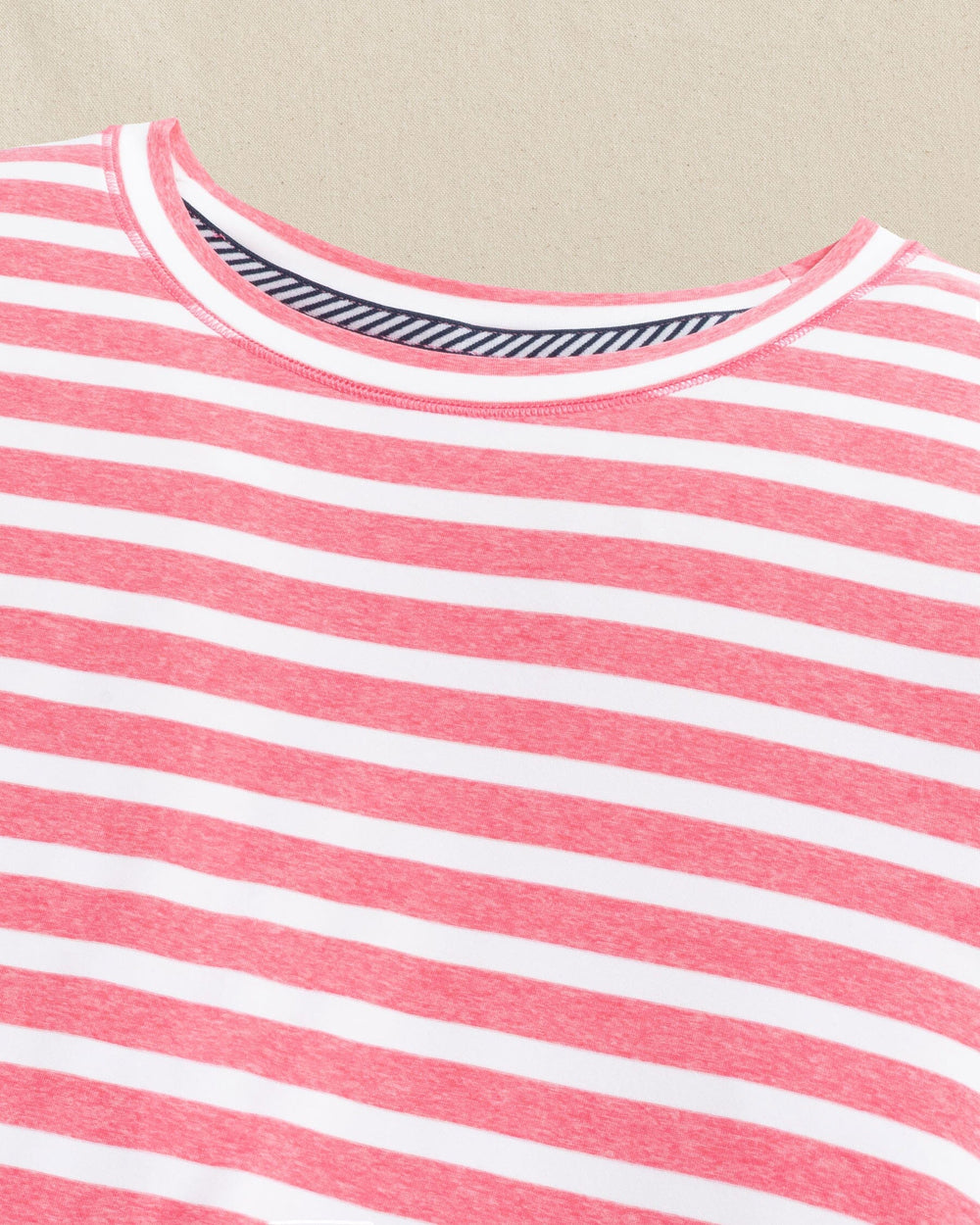The detail view of the Southern Tide Linley Stripe Coastal Breeze® Performance Crew by Southern Tide - Island Pink