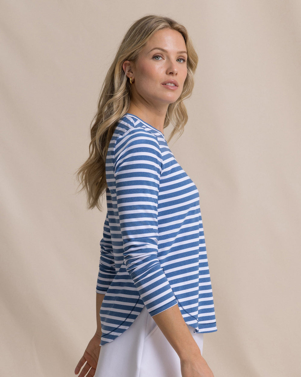 The side view of the Southern Tide Linley Stripe Coastal Breeze® Performance Crew by Southern Tide - Nautical Blue