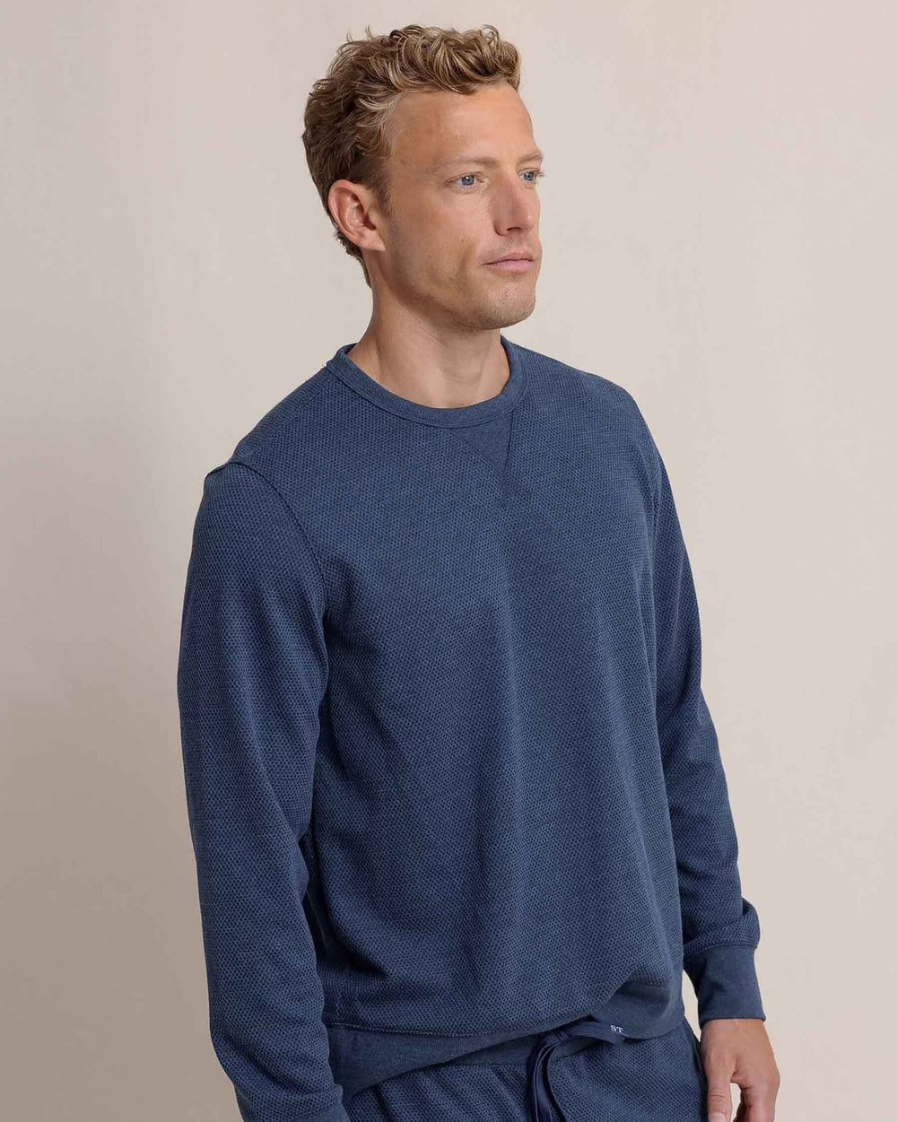 The side view of the Southern Tide Lowland Luxe Textured Crew by Southern Tide - Dress Blue