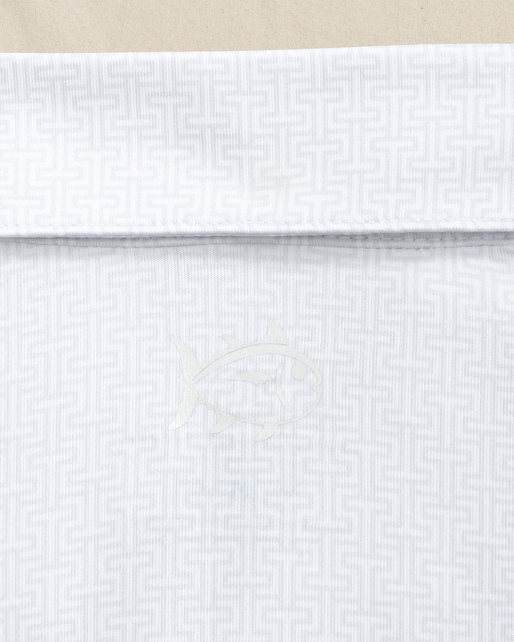 The detail view of the Southern Tide LSU Tigers Driver ST Geo Printed Polo by Southern Tide - Classic White