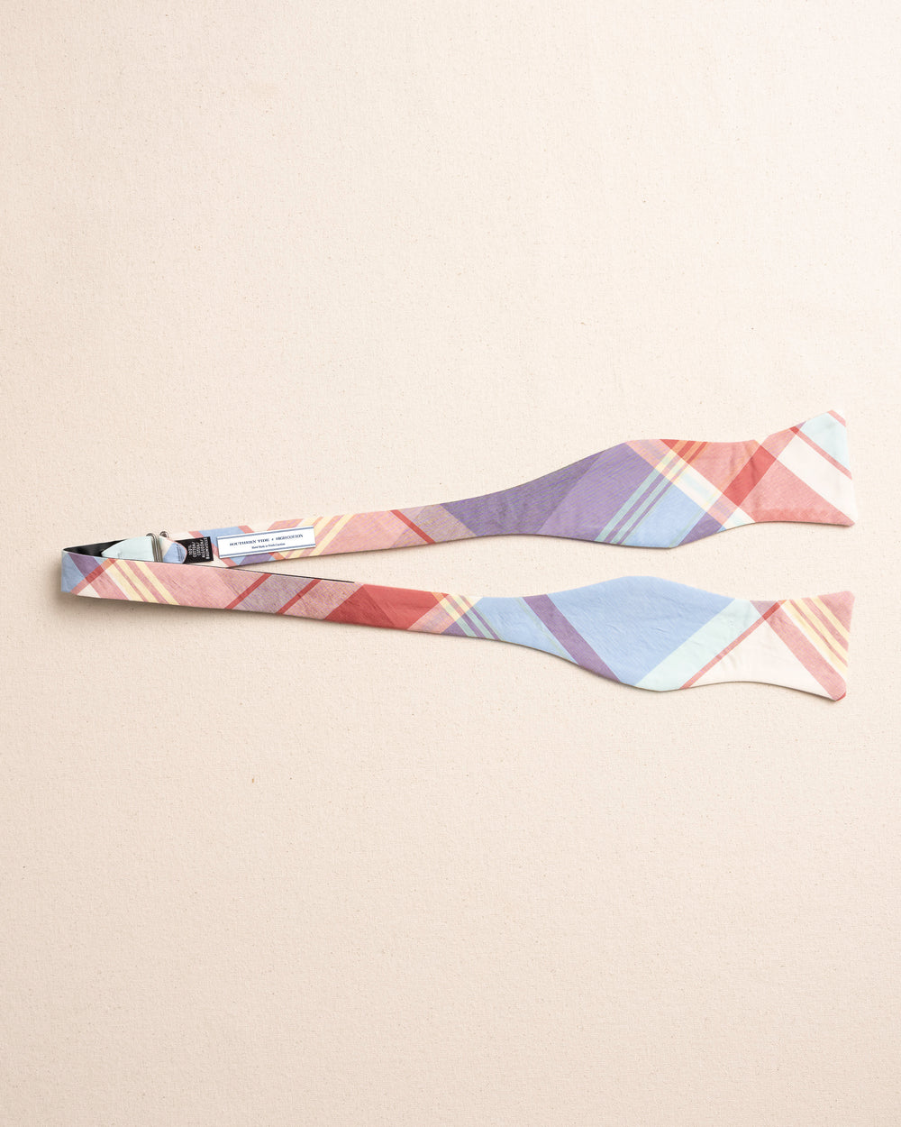 The untied view of the Southern Tide Madras Bow Tie by Southern Tide - White Sand