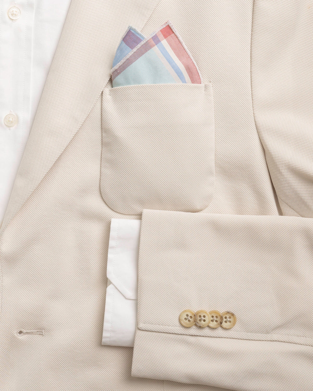 The detail coat view of the Southern Tide Madras Pocket Square by Southern Tide - White Sand