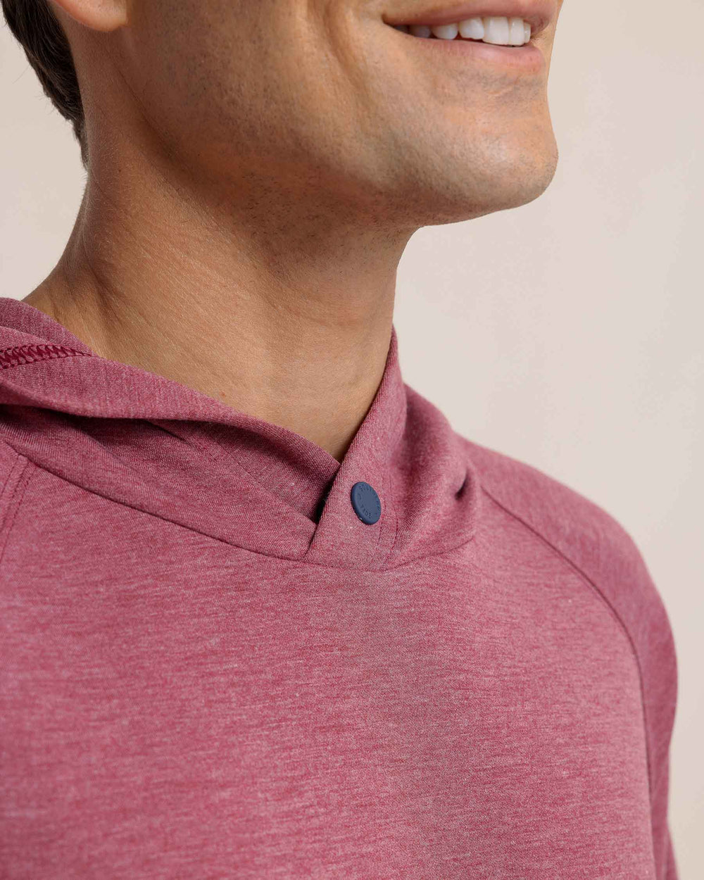 The detail view of the Southern Tide Manteo Heather Interlock Snapfront Hoodie by Southern Tide - Heather Muscadine