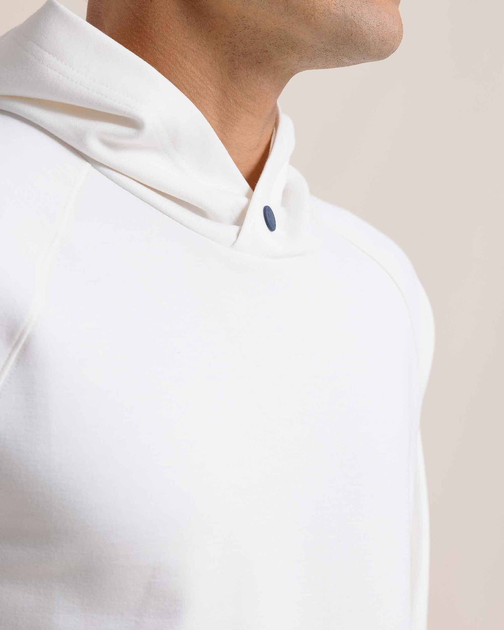 The detail view of the Southern Tide Manteo Heather Interlock Snapfront Hoodie by Southern Tide - Heather Sand White