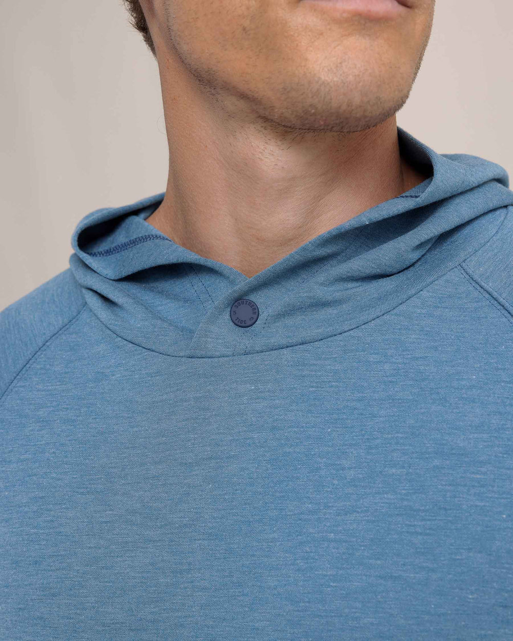 The detail view of the Southern Tide Manteo Heather Interlock Snapfront Hoodie by Southern Tide - Heather Teal Haze