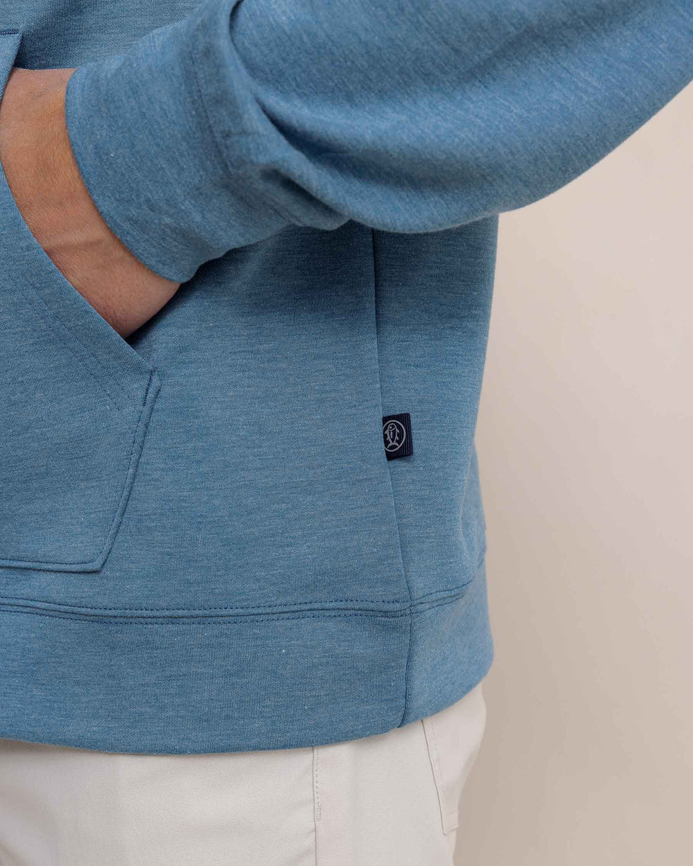 The detail view of the Southern Tide Manteo Heather Interlock Snapfront Hoodie by Southern Tide - Heather Teal Haze