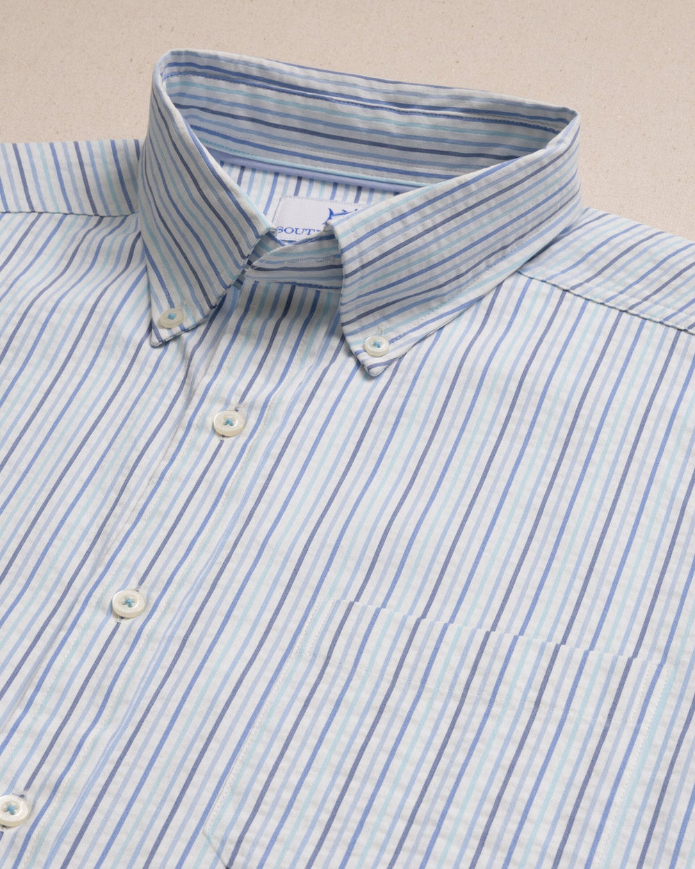 The detail view of the Southern Tide Marina Seersucker Coastal Breeze® Short Sleeve Sport Shirt by Southern Tide - Tropical Breeze Blue