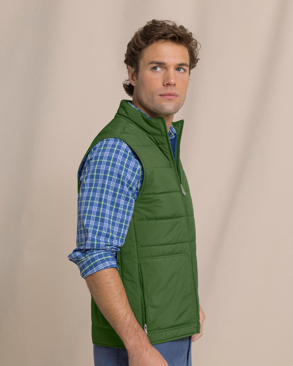 The side view of the Southern Tide Marsh Creek Cove Quilted Vest by Southern Tide - Cedar Green