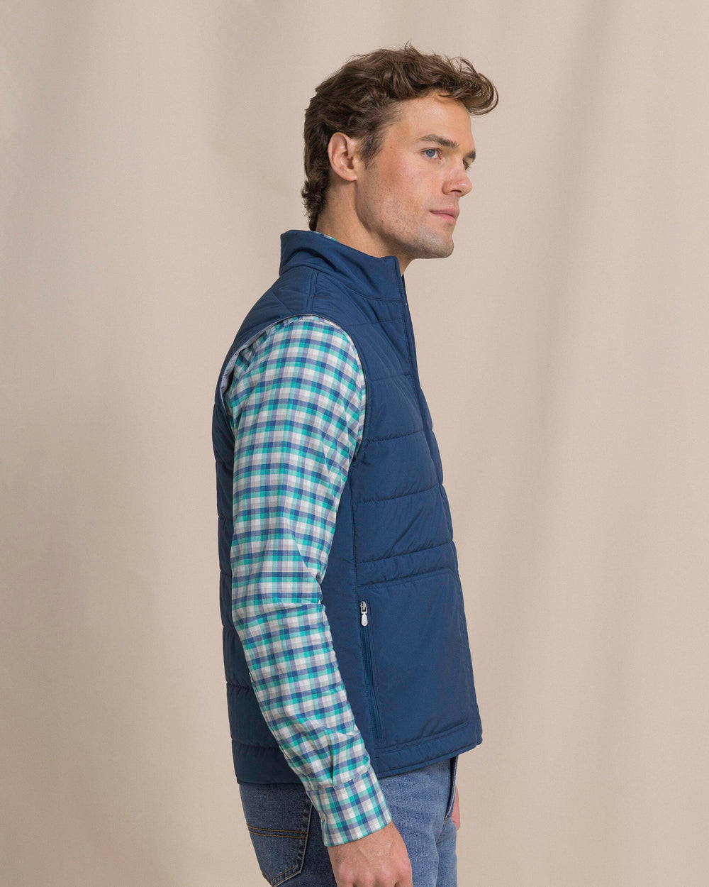 The side view of the Southern Tide Marsh Creek Cove Quilted Vest by Southern Tide - Nautical Blue