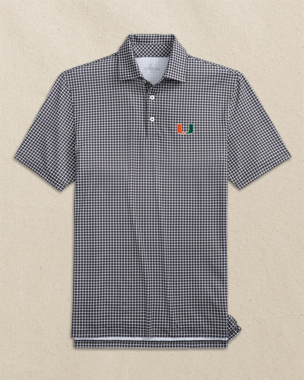 The front view of the Southern Tide Miami Hurricanes Driver Dunes Edge Plaid Polo by Southern Tide - Black