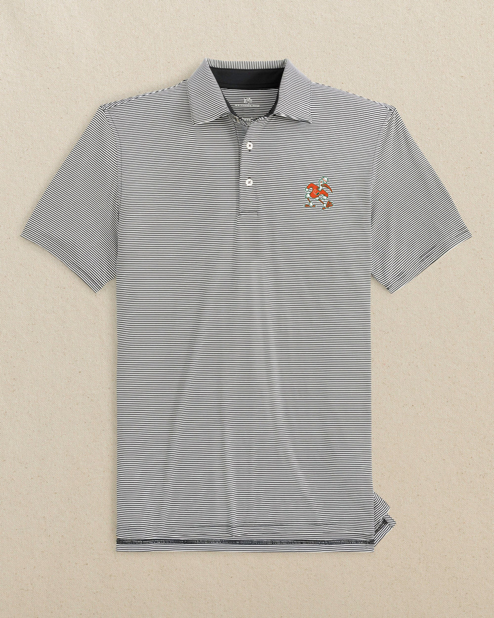 The front view of the Southern Tide Miami Sebastian the Ibis brrr°®-eeze Meadowbrook Stripe Polo by Southern Tide - Caviar Black