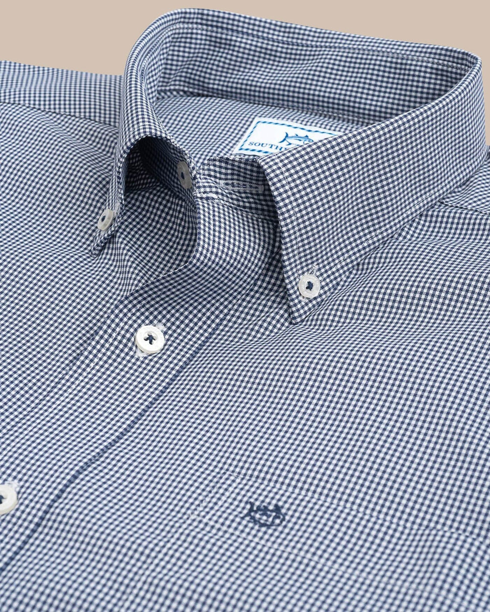 The collar of the Men's Navy Micro Gingham Intercoastal Performance Sport Shirt by Southern Tide - True Navy
