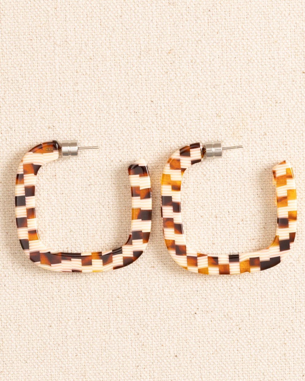 The front view of the Machete Midi Square Hoop Earrings by Southern Tide - Tortoise Checker