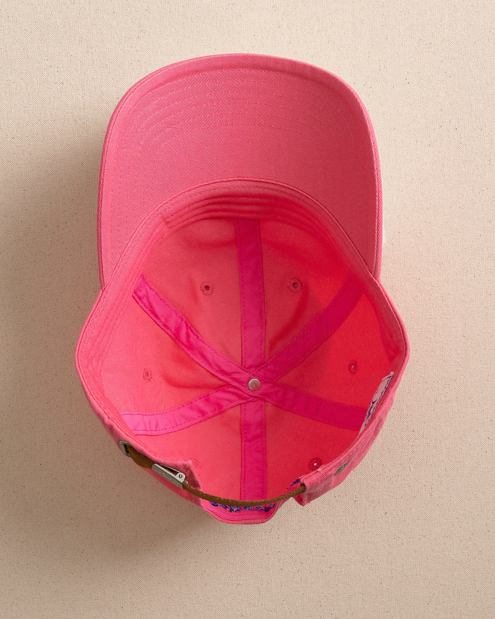 The under view of the Southern Tide Mini Skipjack Leather Strap Hat by Southern Tide - Snapper