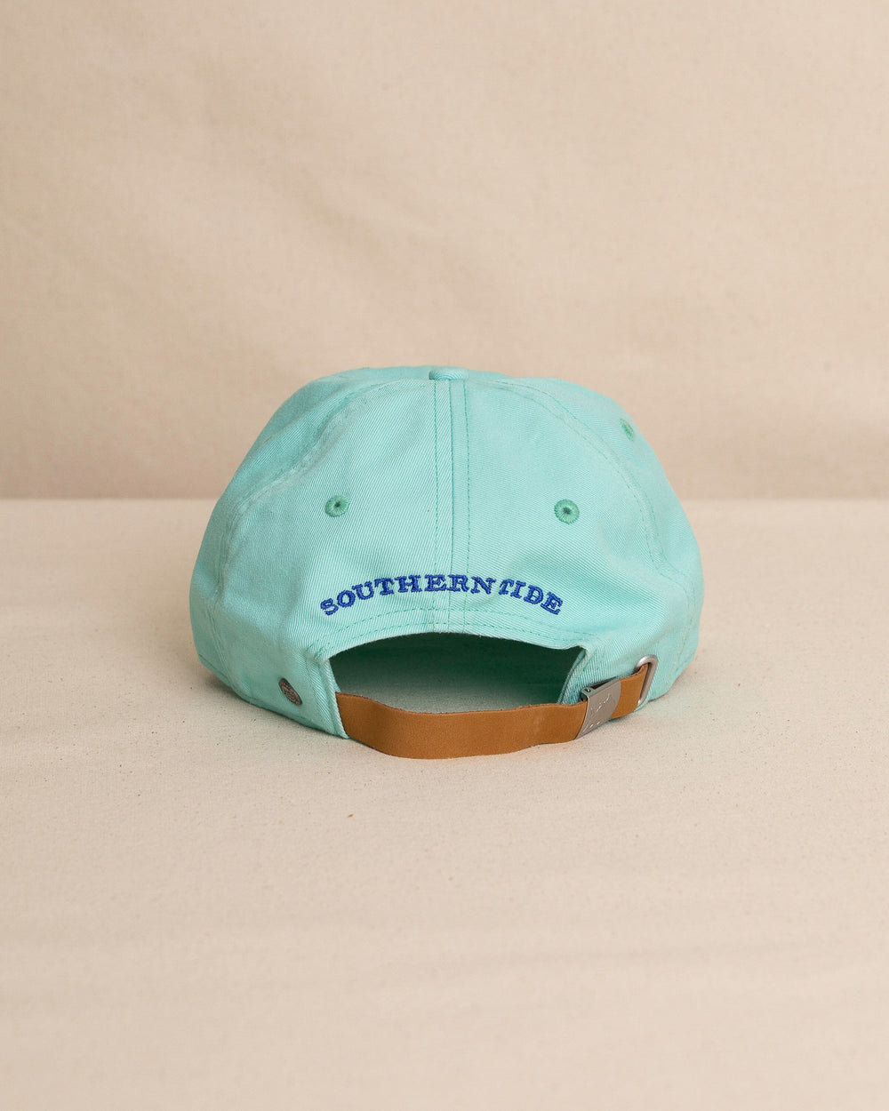 The back view of the Southern Tide Mini Skipjack Leather Strap Hat by Southern Tide - Turtle Green