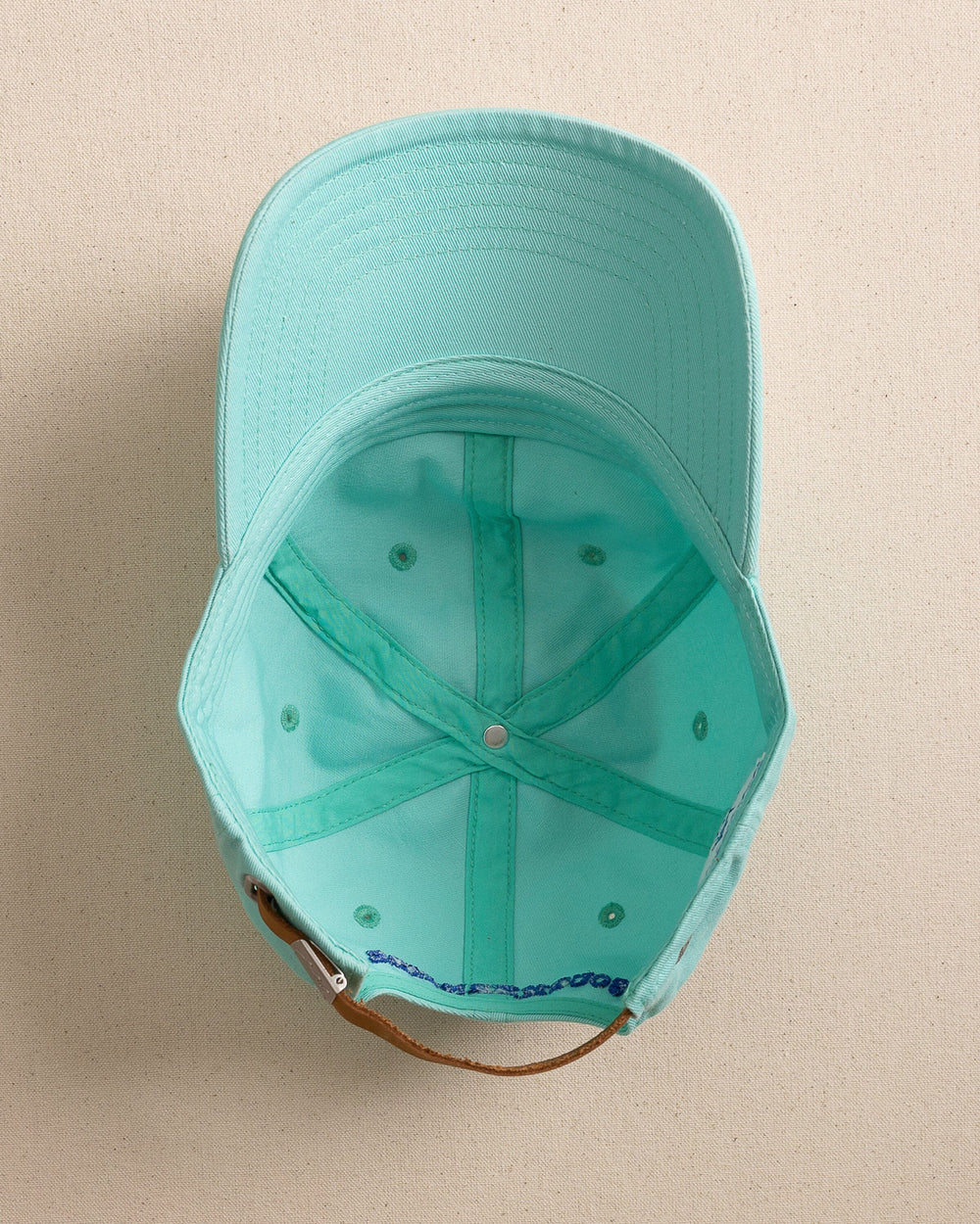 The under view of the Southern Tide Mini Skipjack Leather Strap Hat by Southern Tide - Turtle Green