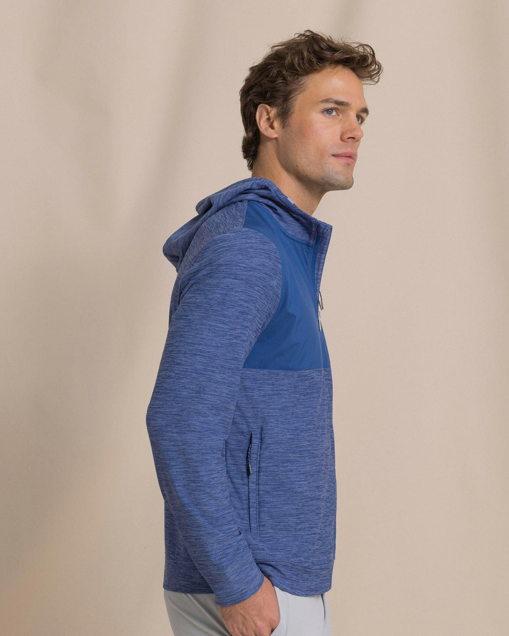 The side view of the Southern Tide Mixed Media Full Zip Jacket by Southern Tide - Heather Nautical Blue
