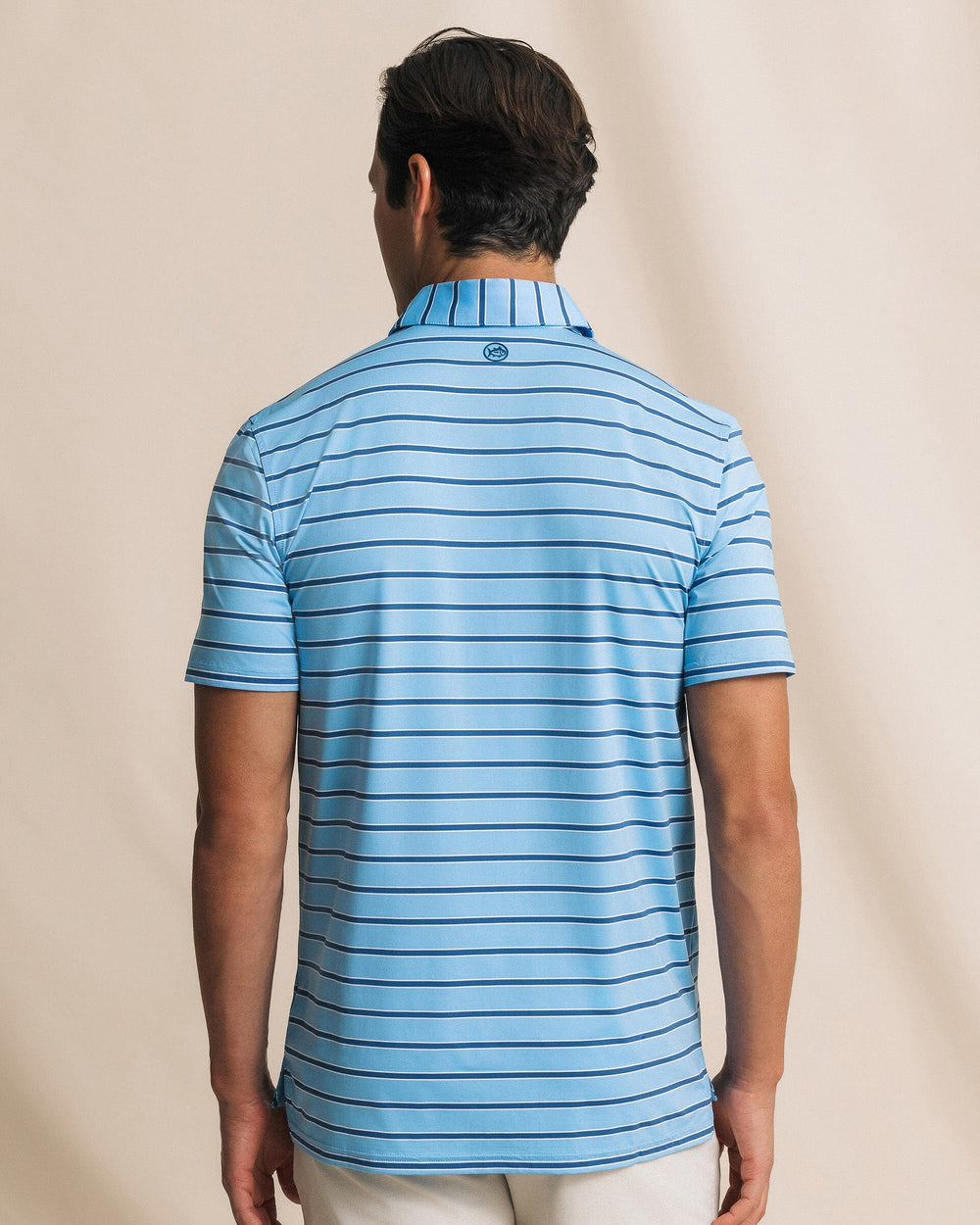 The back view of the Southern Tide Moonlight Bay Stripe Coastal Breeze® Performance Polo by Southern Tide - Ocean Channel