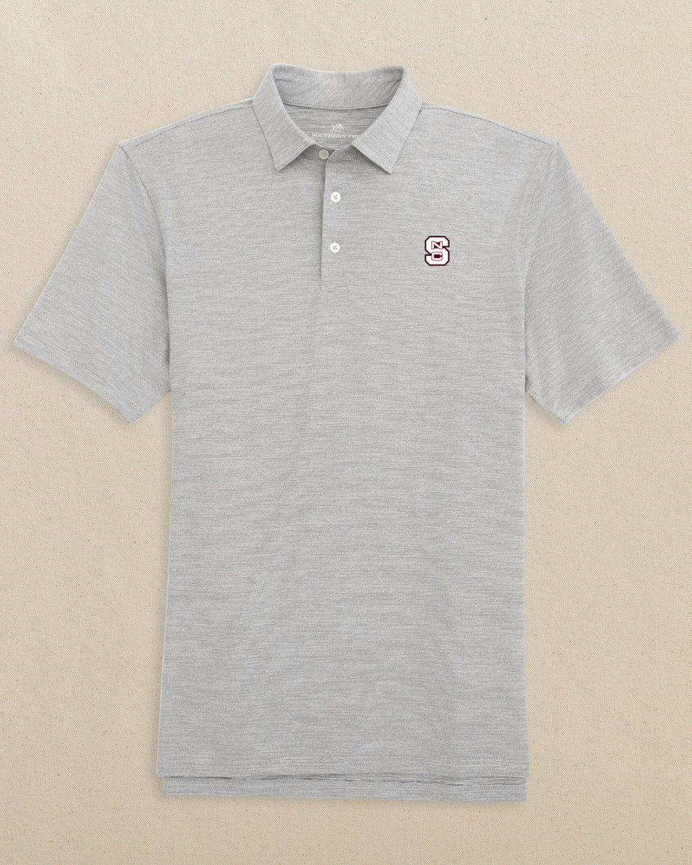 The front view of the NC State Driver Spacedye Polo Shirt by Southern Tide - Black