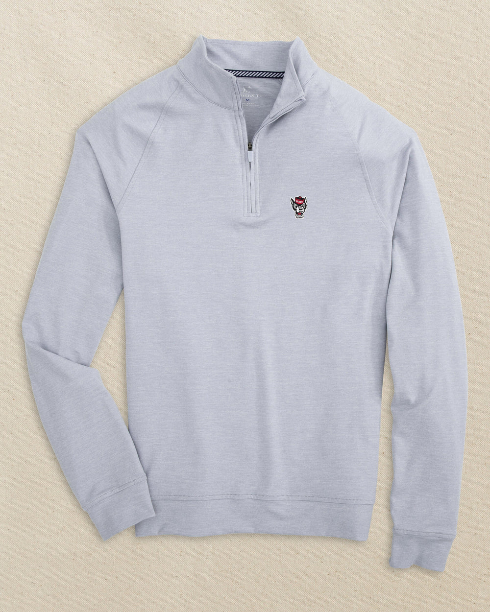 The front view of the Southern Tide NC State Wolf Head Cruiser Quarter Zip by Southern Tide - Heather Slate Grey