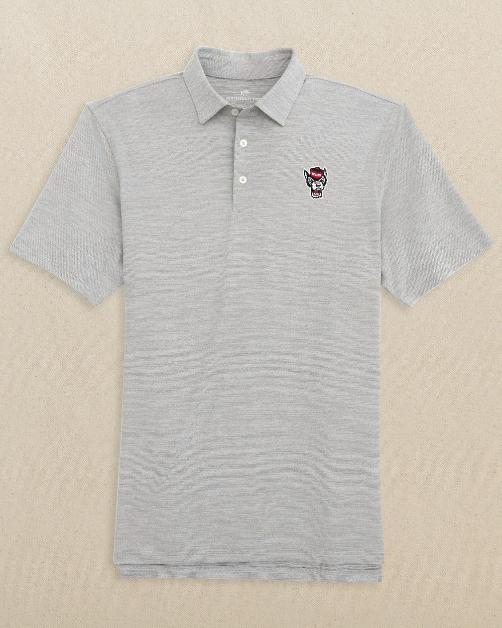 The front view of the Southern Tide NC State Wolf Head Driver Spacedye Polo by Southern Tide - Black