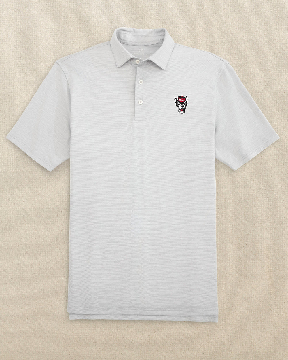 The front view of the Southern Tide NC State Wolf Head Driver Spacedye Polo by Southern Tide - Slate Grey