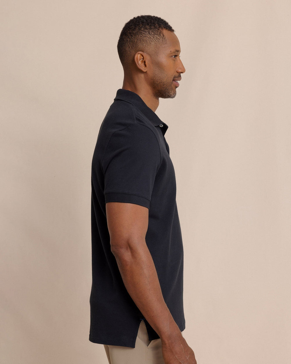 The side view of the Southern Tide Skipjack Polo Shirt by Southern Tide - Midnight Black