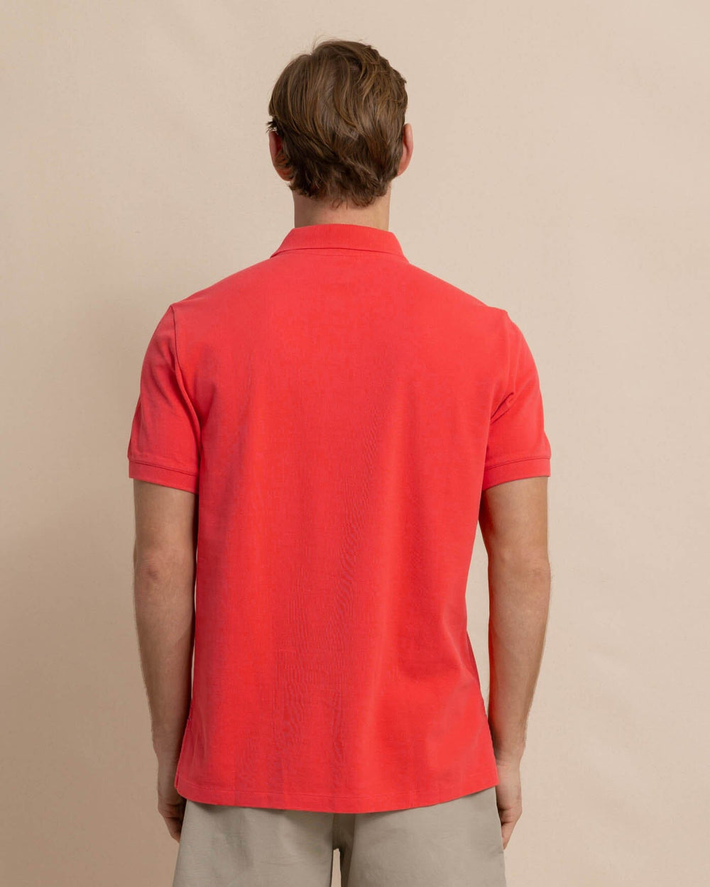 The back view of the Southern Tide new-skipjack-polo-shirt by Southern Tide - Paprika Red