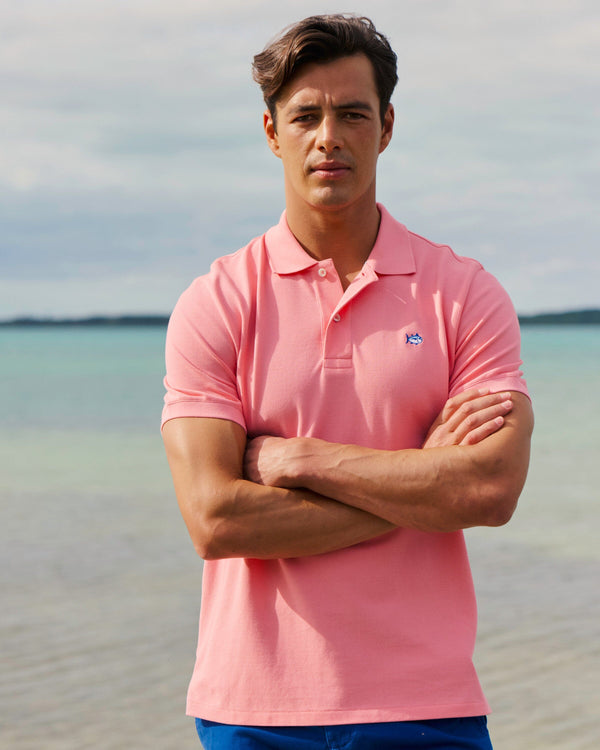 The lifestyle view of the Southern Tide Skipjack Polo Shirt by Southern Tide - Sea Pink