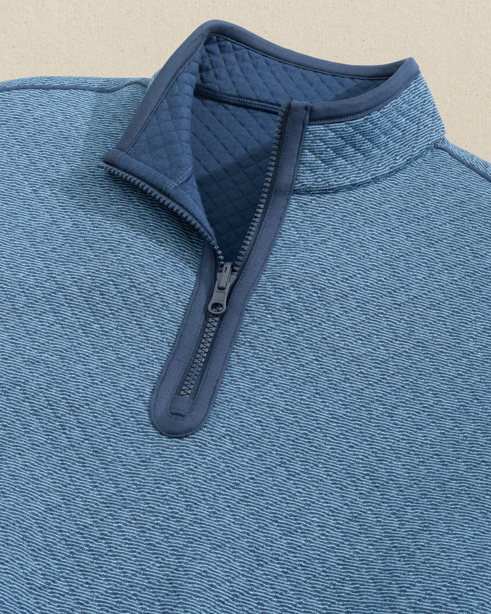 The detail view of the Southern Tide Oak Island Reversible Quarter Zip by Southern Tide - Dress Blue
