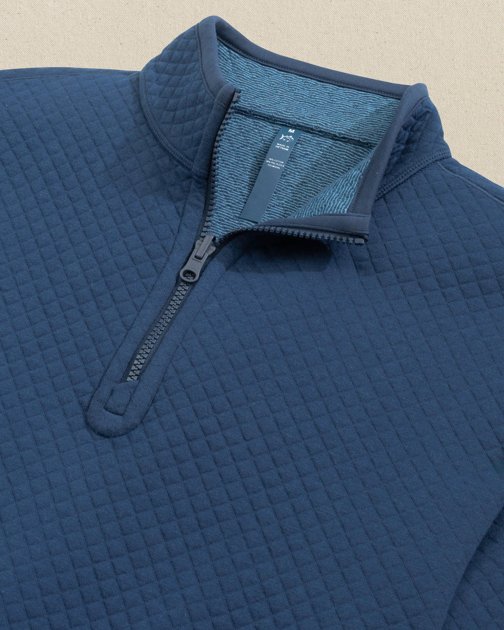 The detail view of the Southern Tide Oak Island Reversible Quarter Zip by Southern Tide - Dress Blue