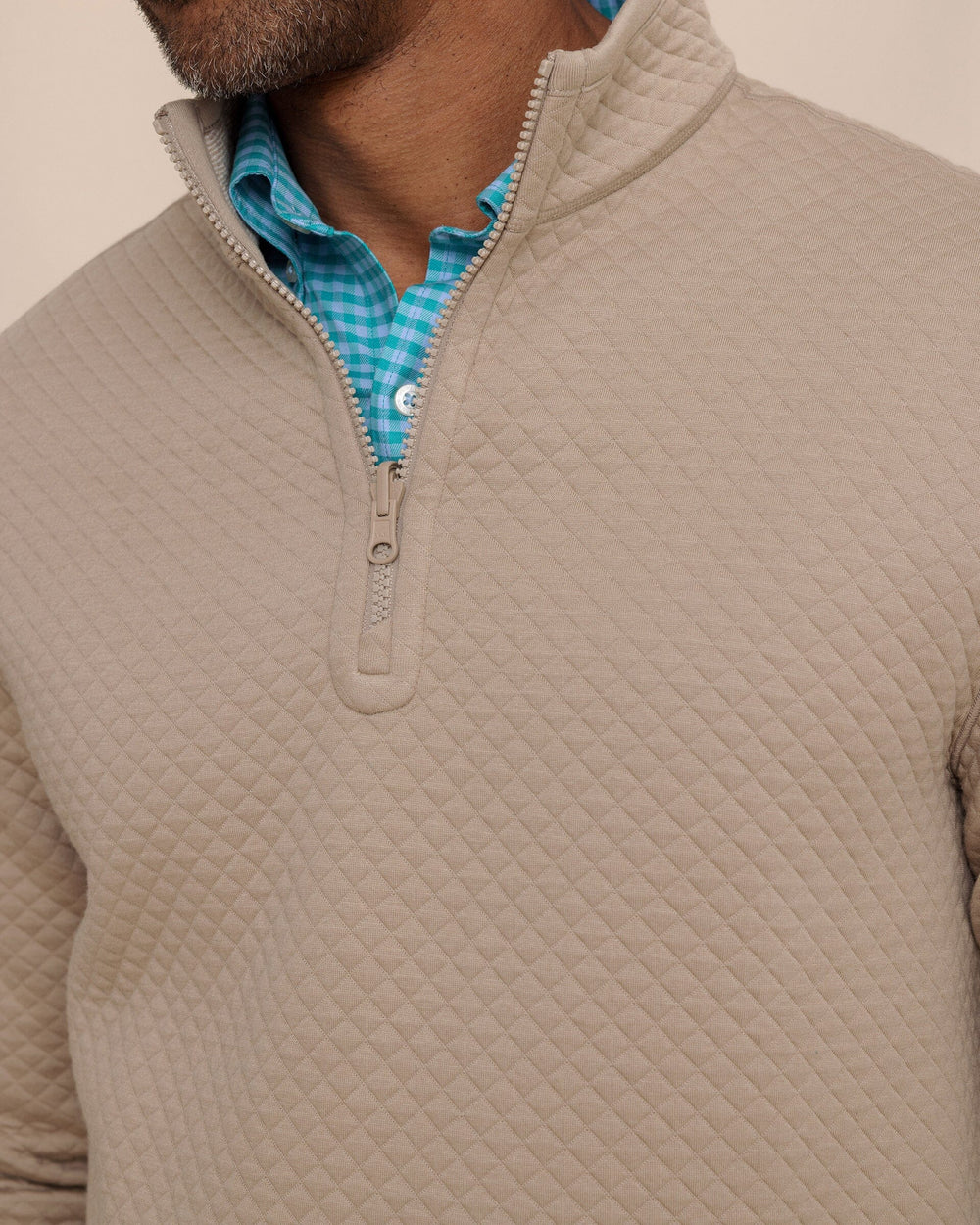 The detail view of the Southern Tide Oak Island Reversible Quarter Zip by Southern Tide - Sandstone Khaki