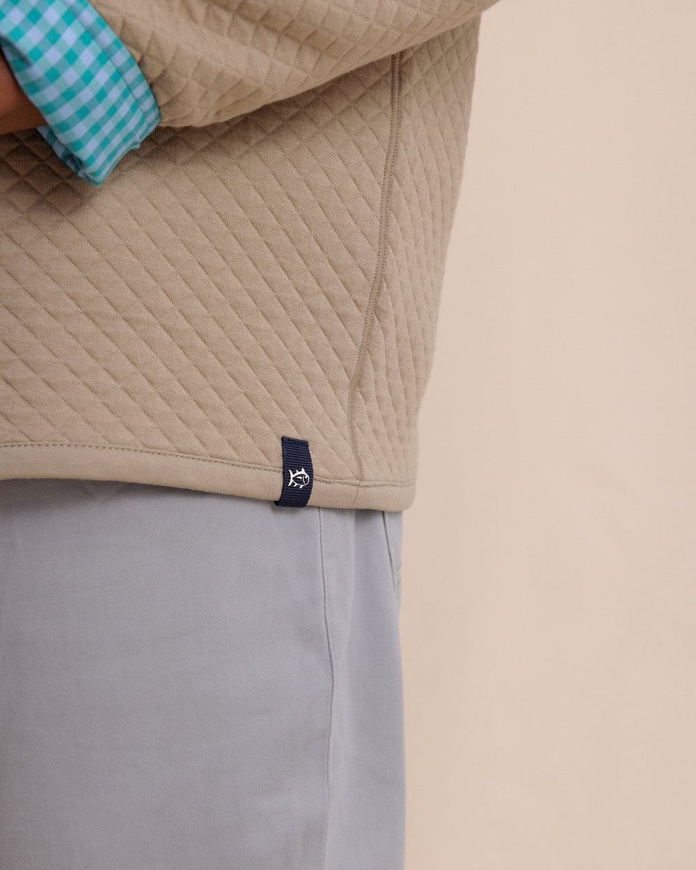 The detail view of the Southern Tide Oak Island Reversible Quarter Zip by Southern Tide - Sandstone Khaki